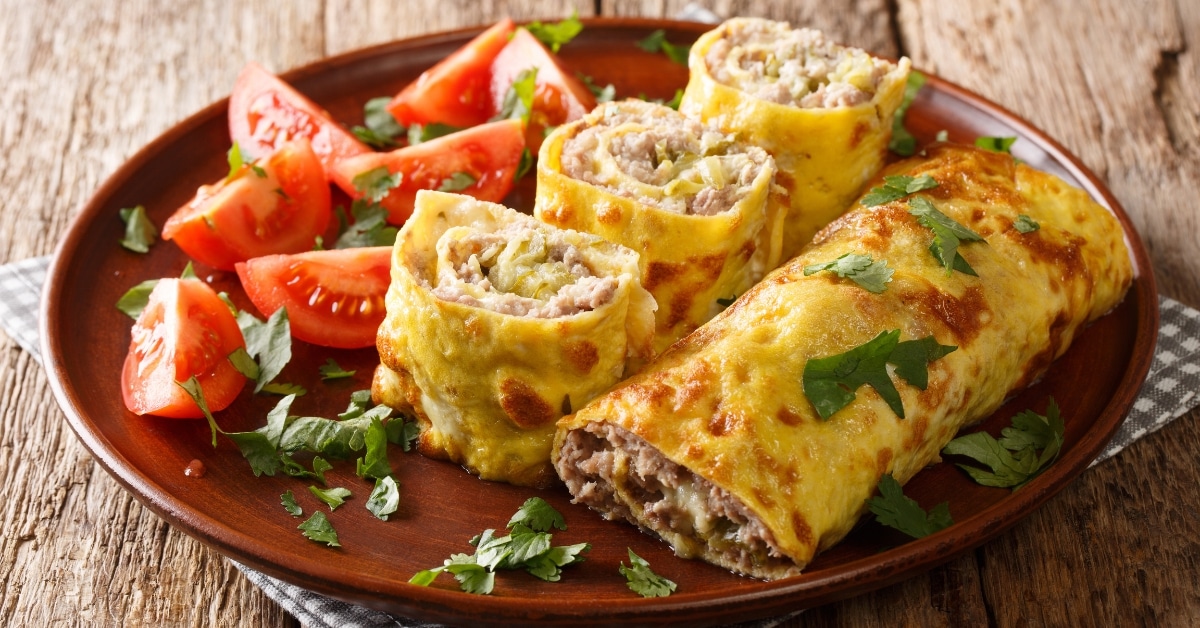 A plate of egg rolls tomatoes, a delicious and balanced meal