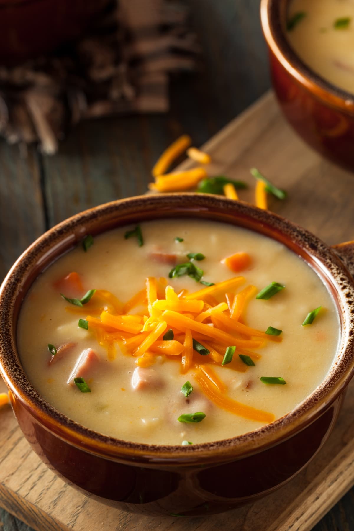 Beer Cheese Soup in Wooden Bowl