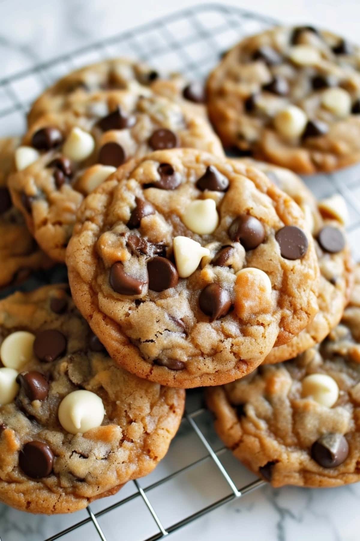 Fresh baked marry me cookies with chocolate chips on a cooling rack.
