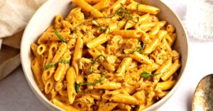 Bowl of Creamy Cajun Chicken Pasta with Herbs