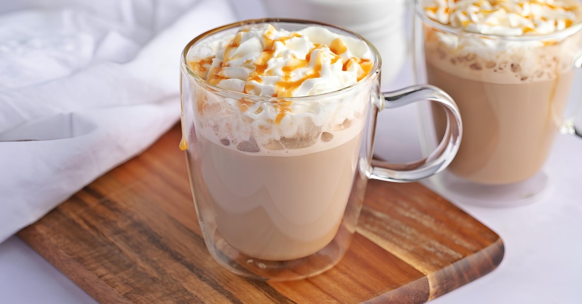 Caramel macchiato served in glass mug