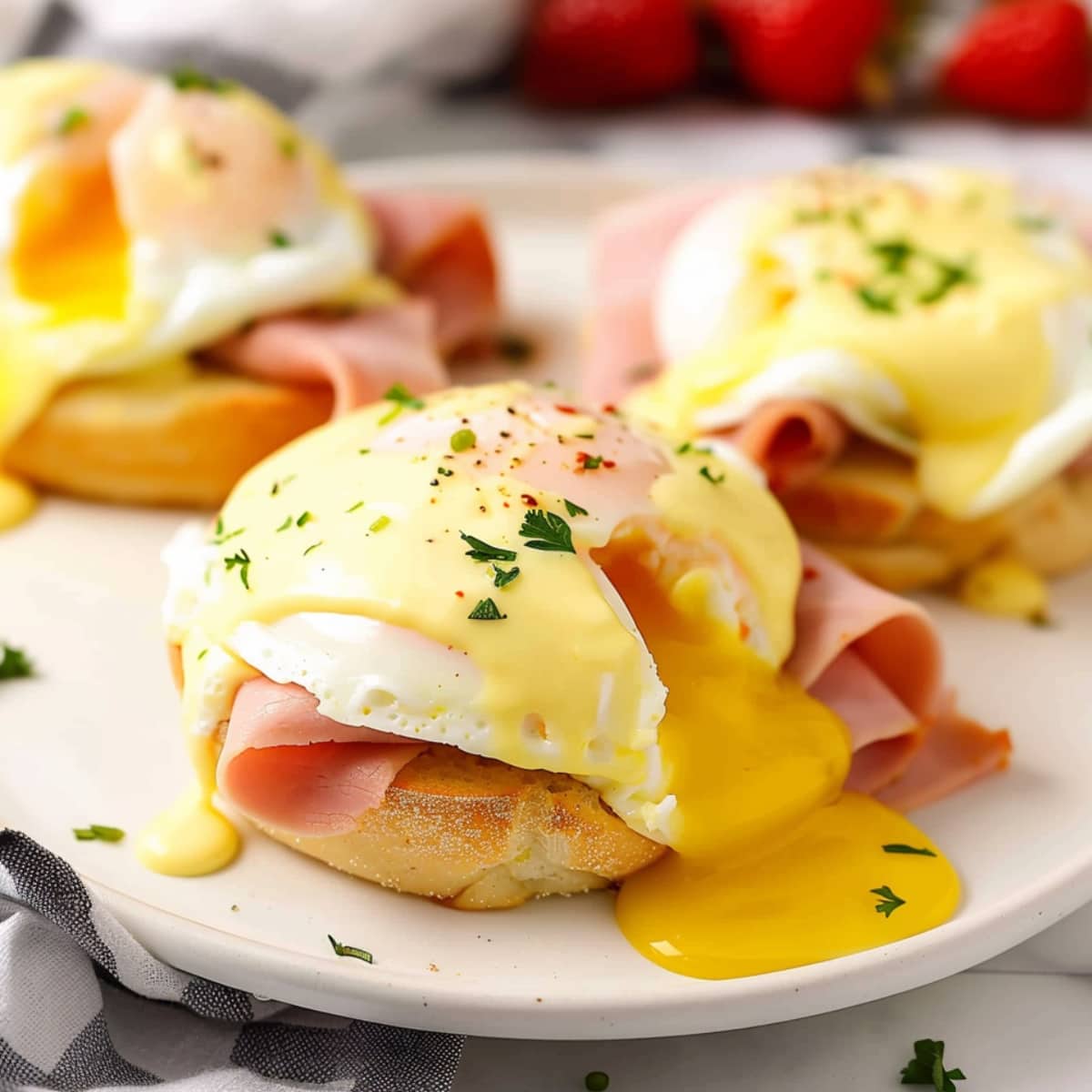 Eggs benedict with ham, poached egg and creamy hollandaise sauce