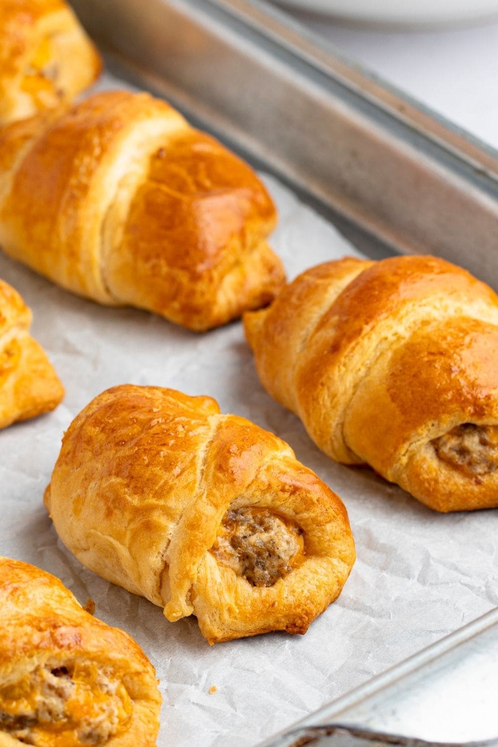 Sausage Cream Cheese Crescent Rolls on a Baking Sheet