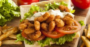 Homemade Shrimp Pho Bo Sandwich with Tomatoes, Lettuce and Fries