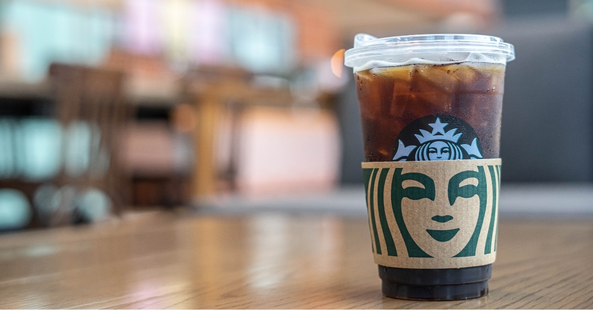 Iced coffee Starbucks on a wooden table.