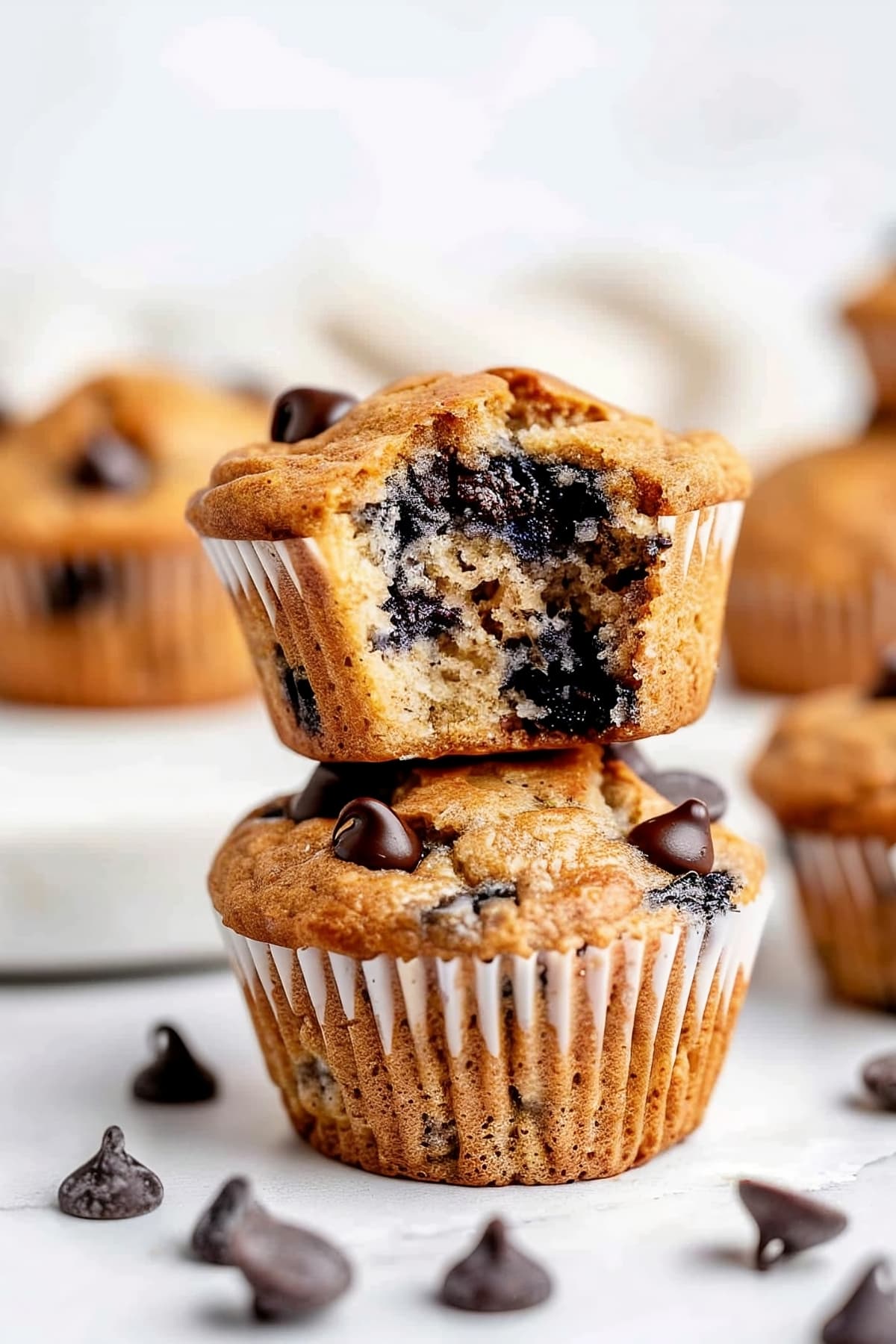 Stacked of homemade kodiak muffins with chocolate chips and blueberries