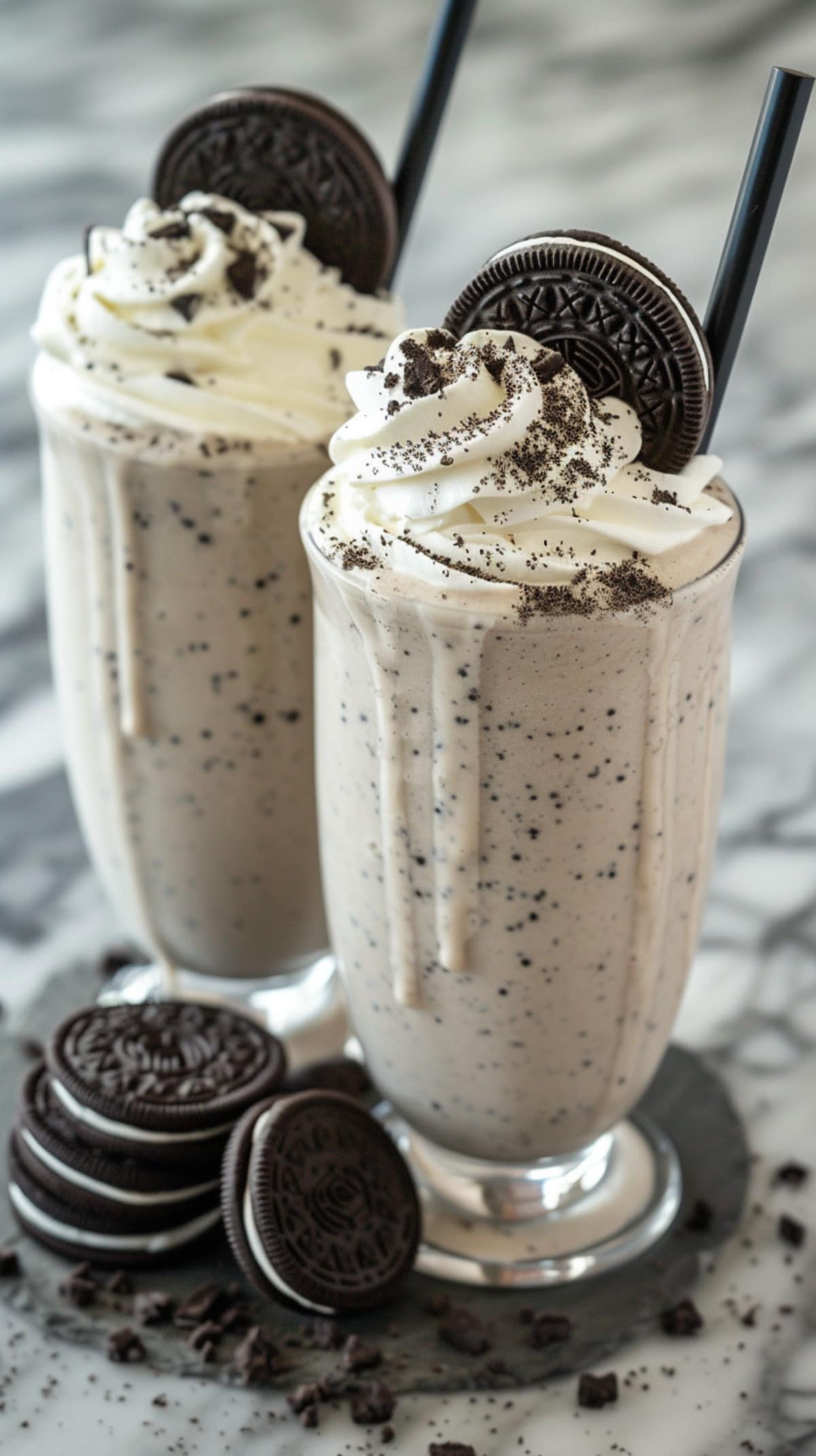 2 Oreo Milkshakes with Whipped Cream and Straws