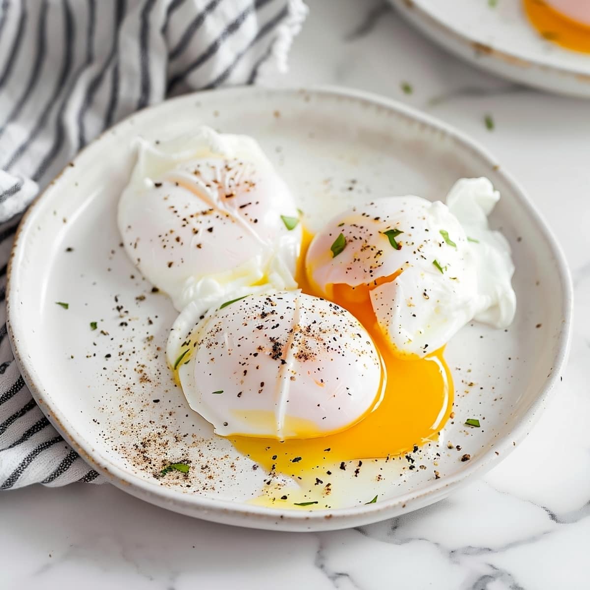 Poached eggs with seasonings and herbs in a white plate 