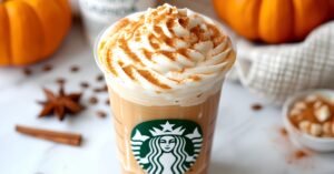 Refreshing and flavorful pumpkin spice latte with whipped cream and cinnamon powder