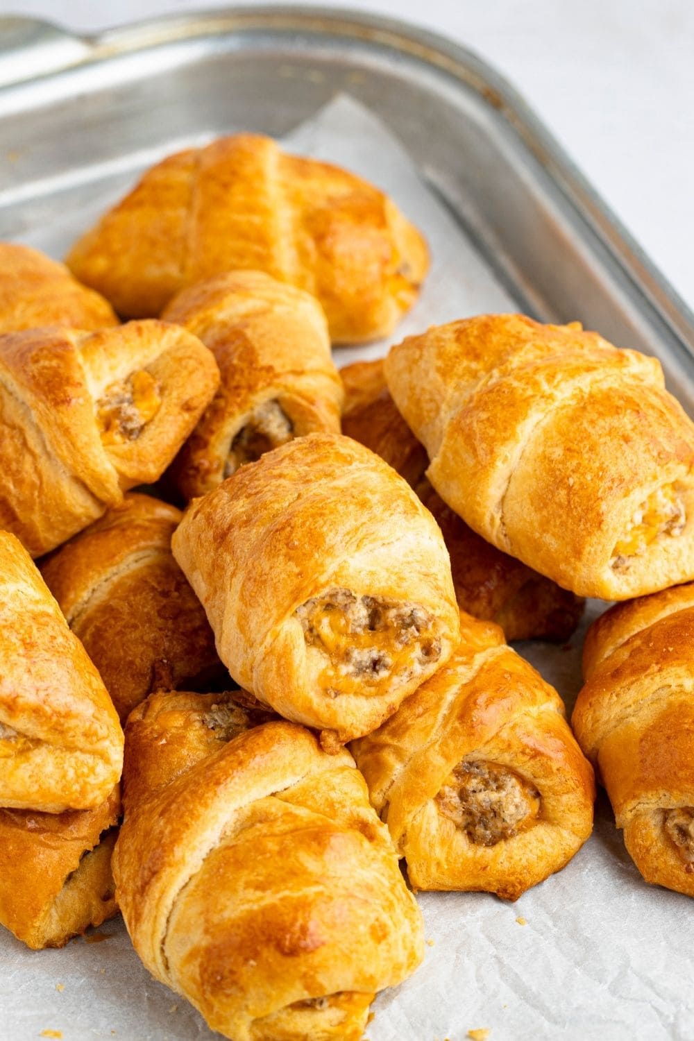 Sausage Cream Cheese Crescent Rolls filled with sausage, cream cheese, and cheddar cheese. 
