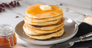 Homemade Cracker Barrel Pancakes With Butter and Maple Syrup